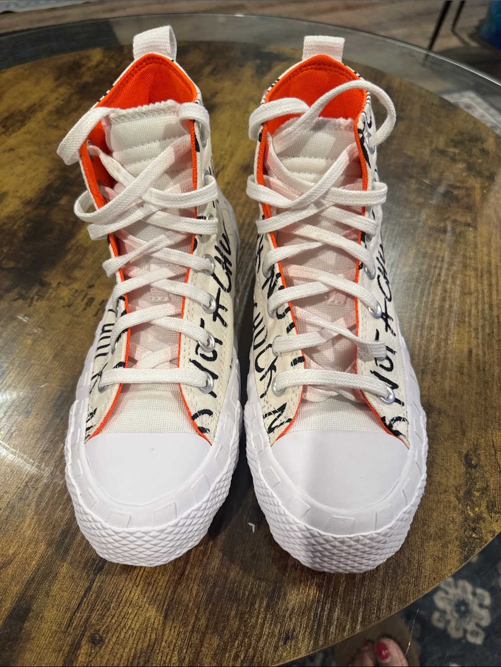 Converse women’s  White High-Top Sneakers with Black Script and Orange Accents